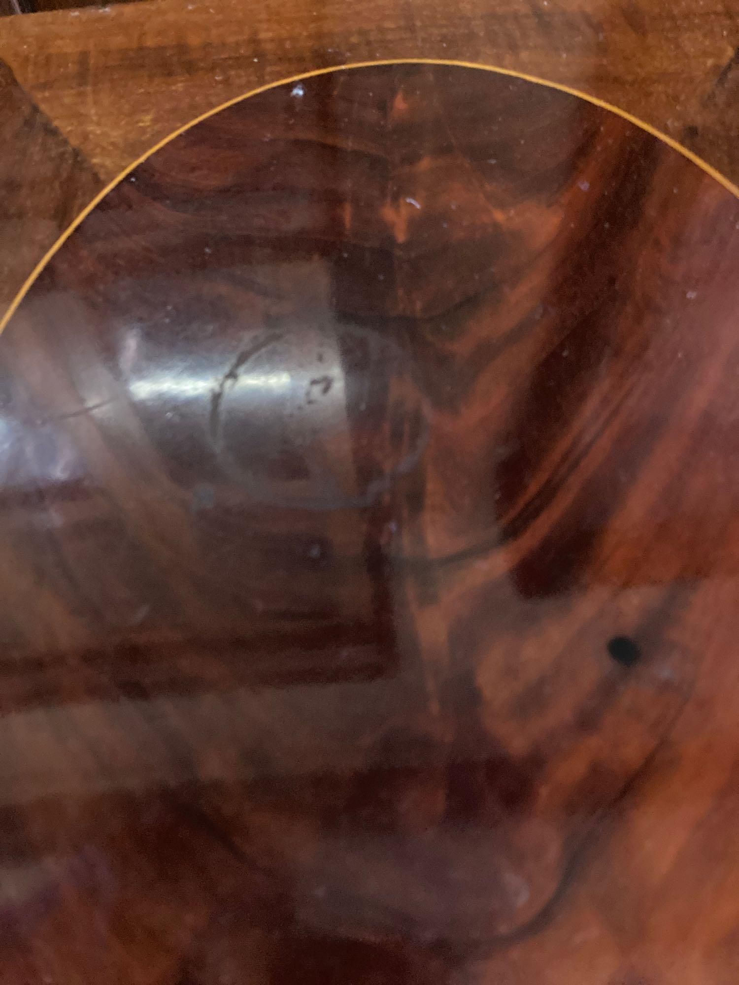 A nest of three Edwardian inlaid mahogany occasional tables, width 54cm